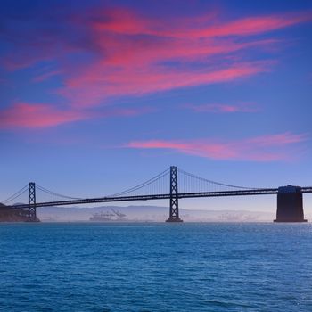 San Francisco Bay bridge from Pier 7 sunset in California USA