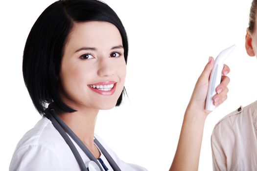 Female doctor or nurse checking temperature of her patient