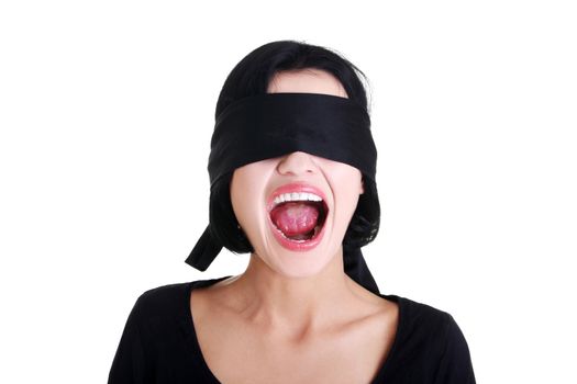 Portrait of a beautiful frighten young blindfold woman screaming