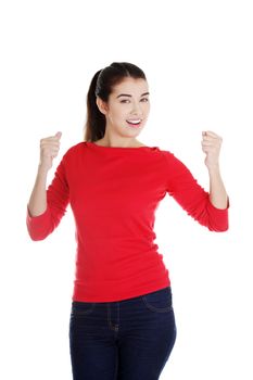 Happy ,excited young woman with fists up