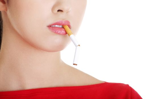 Young woman with broken cigarette. Stop smoking concept.