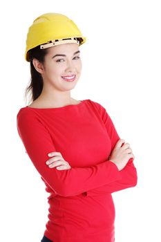 Portrait of confident female worker in helmet. Isolated on white