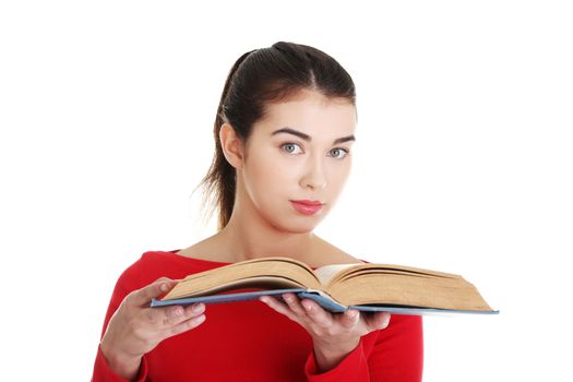 Young woman reading an old book, isolated on white