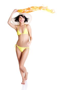 Sexy brunette woman posing in yellow bikini