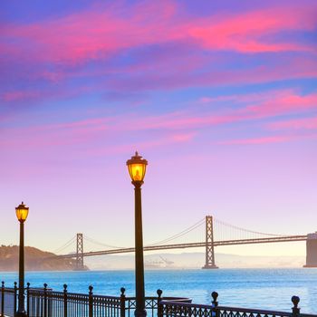 San Francisco Bay bridge from pier 7 in California sunset USA