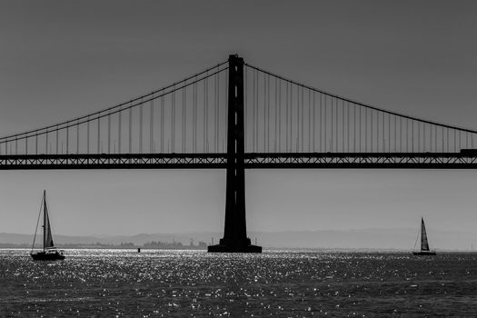 San Francisco Bay bridge sailboat from Pier 7 in California USA