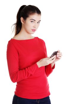Young woman useing a modern mobile over a white background