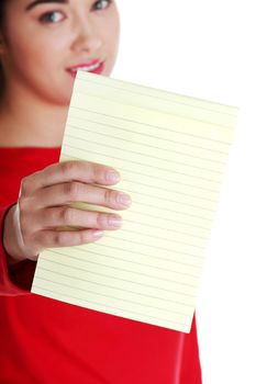 Young happy student woman showing blank notepad, isolated on white background