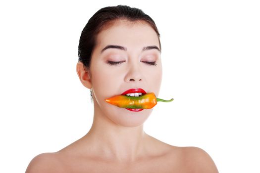 Beautiful woman with hot paprika, isolated on white