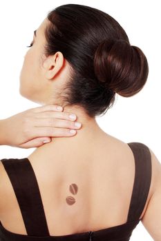 Elegant woman in dress with coffee bean symbol on her back.