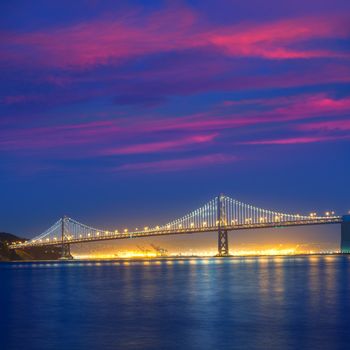 San Francisco Bay Bridge at sunset from Pier 7 in California USA