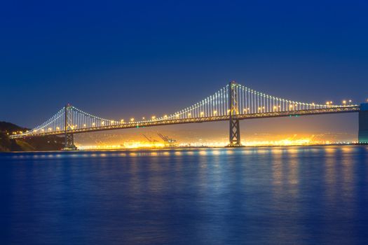 San Francisco Bay Bridge at sunset from Pier 7 in California USA