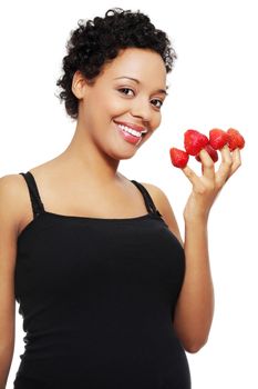 Young happy pregnant afro american woman with strawberries, isolated on white background
