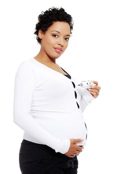 Pregnant woman holding a toy airplane