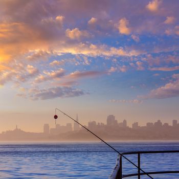 San francisco fog skyline with fishing rod in the mist California USA