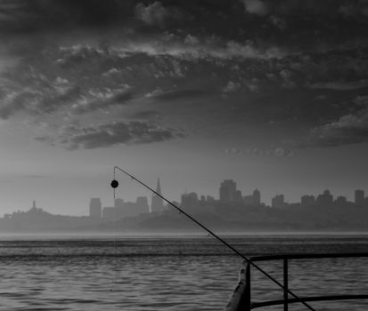 San francisco fog skyline with fishing rod in the mist California USA