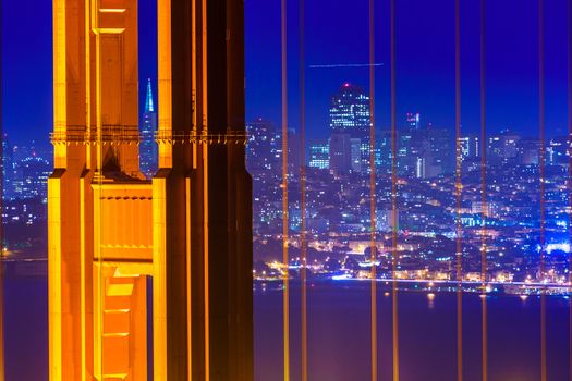 San Francisco Golden Gate Bridge sunset view through cables in California USA