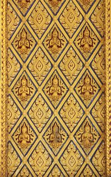 Background of ancient traditional ornate Thai art on Thai Buddhist temple door.THIS IMAGE IS PUBLIC DOMAIN FROM A THAI TEMPLE. NO COPYRIGHT ON THE ARTWORK. CLASSICAL THAI MOTIF COMMON ON ALL TEMPLES IN THAILAND.