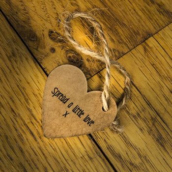 Spread a little love message on a wooden floor