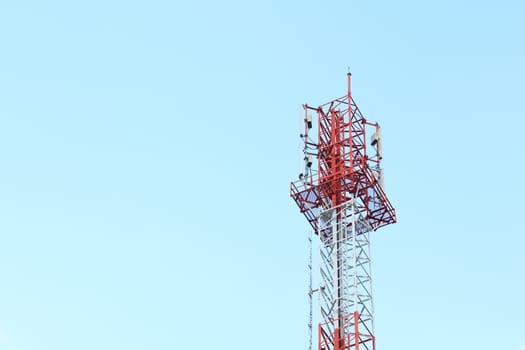 Communication tower against a blue sky