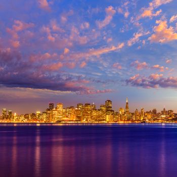 San Francisco sunset skyline in California with reflection in bay water USA