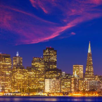 San Francisco sunset skyline in California with reflection in bay water USA