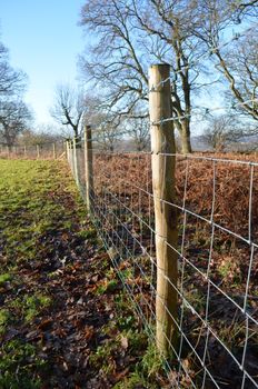 Wire fence surrounding an English farm.