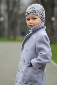 Romatic portrait of a  little boy in the park