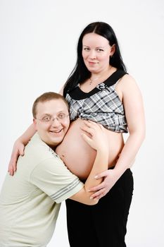 Young happy parents. Husband and pregnant wife