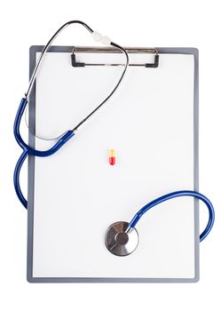 Blank sheet and stethoscope over white background