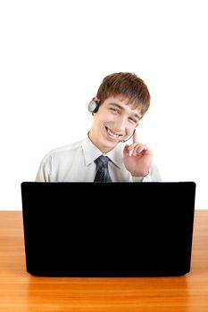 Handsome Teenager With Headset at the Desk with Laptop Isolated on the White