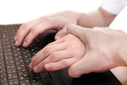 One Hand catch other Hand on Laptop Keyboard Closeup