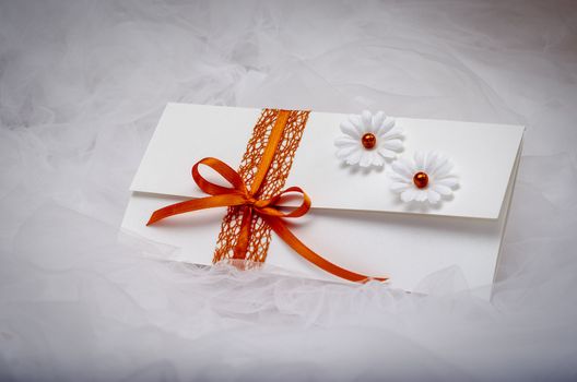 Elegant homemade wedding invitation with simple decoration.