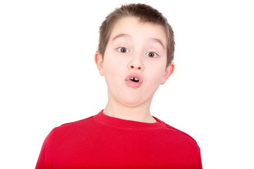 Young boy reacting with a look of amazement and awe as he stares wide eyed at the camera with his mouth forming on oh, isolated on white