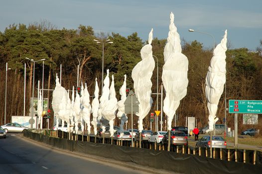 POZNAN, POLAND - JANUARY 12: Trees covered for winter with some protective material on street in Poznan, Poland 12.01.2014