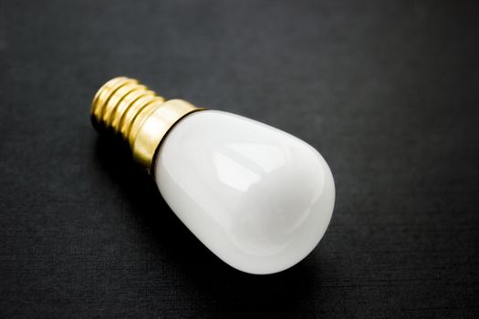 Light bulb on a black background.