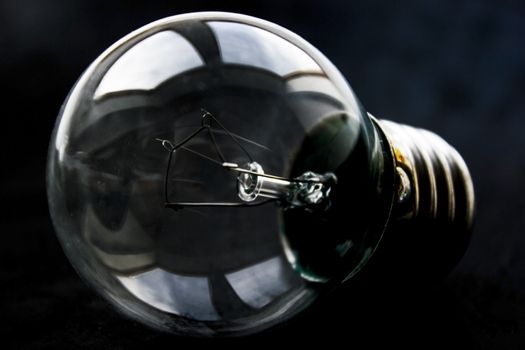 Light bulb on a black background.