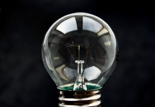 Light bulb on a black background.