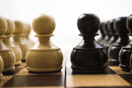 Chess pieces on a board in different compositions.