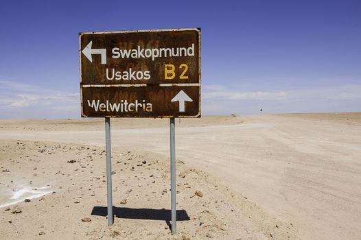 An old signpost in the Namib Desert .