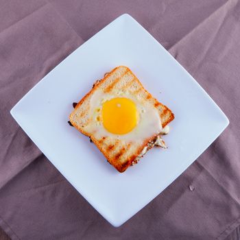 French toast seen from above, over whte plate