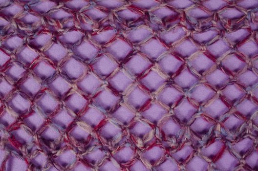 A coarsely knitted  piece of fabric in the shape of a mesh