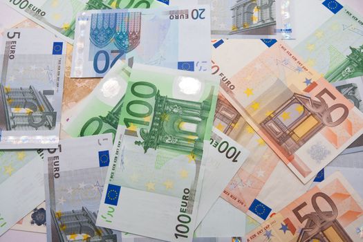 Many euro banknotes making european currency background