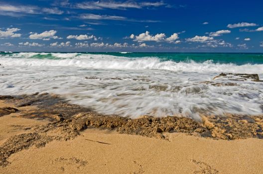 Golden sand and blue sky of a greek beach at Crete