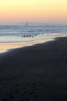 sunset at Ormond Beach with beautiful sky and blue water