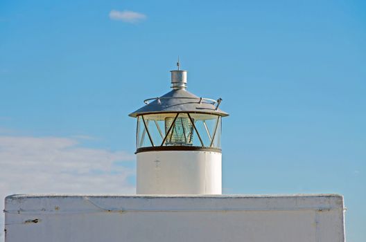 Small lighthouse placed in Talamone, in front of Tuscan Archipelago