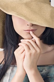 Glamour of Asian beauty with hat, closeup portrait.