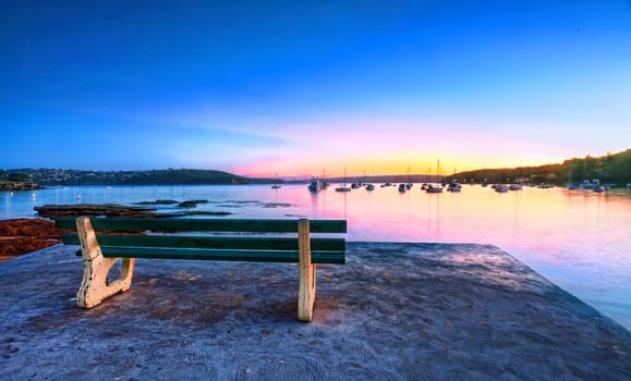 Come take a seat, watch the sunrise and admire the tranquil views of Balmoral, Australia.  Buyers note  long 22sec exp, some motion in boats etc