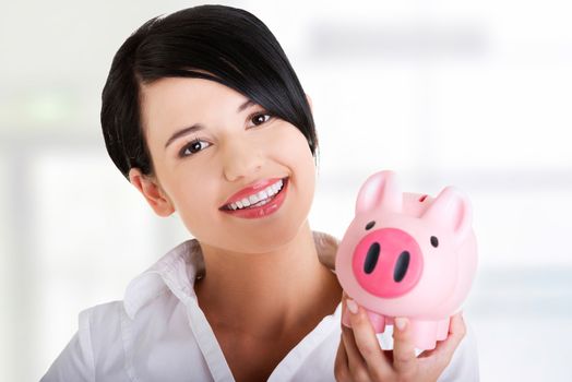 Happy business woman with her savings, isolated