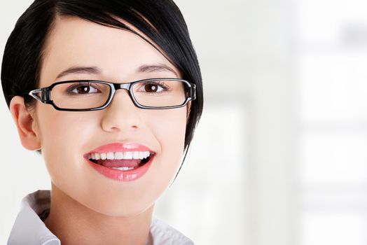 Portrait of young businesswoman or student in elegant clothes